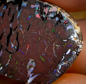 62.6cts - Australian Boulder Opal. Black Tribal Pattern red lightning